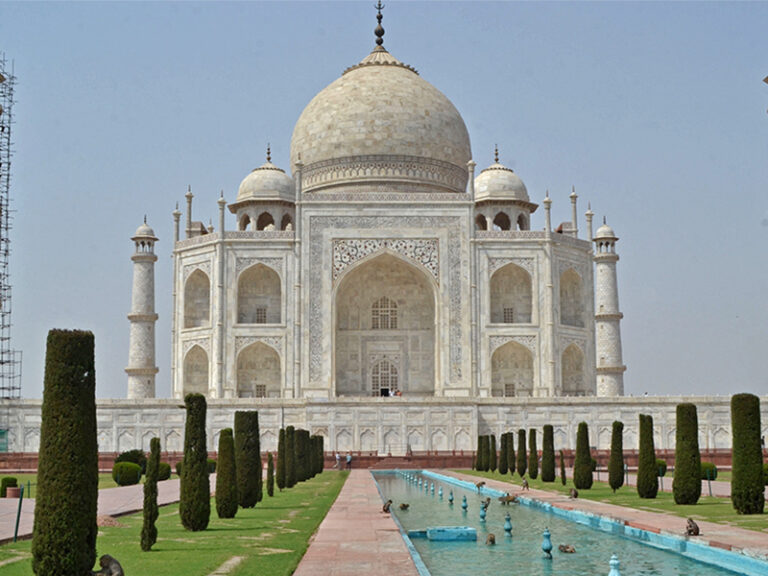 The Taj Mahal mausoleum is seen deserted apart from a few monkeys sprawling around the fountain area of the monument, after an order by the administration was issued to close all protected monuments and tourist spots for a duration of a month to curb the spread of Covid-19 coronavirus infections in Agra on April 15, 2021. (Photo by Pawan SHARMA / AFP)